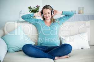 Pregnant woman listening to music