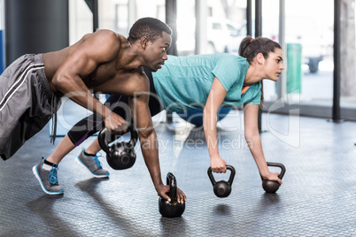 Athletic man and woman working out