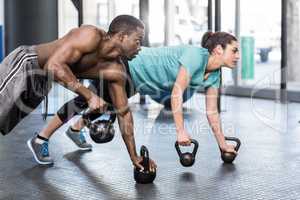 Athletic man and woman working out