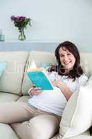 Pregnant woman reading a book