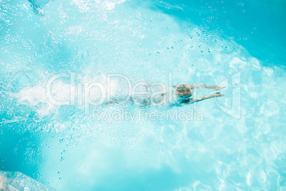 Woman diving in the pool