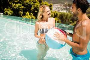 Happy couple with beach ball