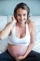 Pregnant woman listening to music