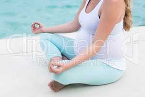 Pregnant woman doing yoga