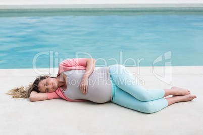 Pregnant woman relaxing outside