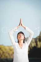 Calm brunette doing yoga