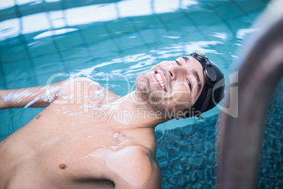 Handsome man resting in the water