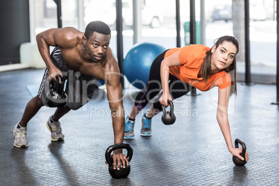 Athletic man and woman working out