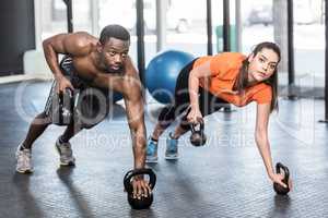 Athletic man and woman working out