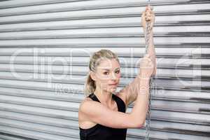 Fit woman holding chain