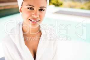 Smiling brunette with white towel