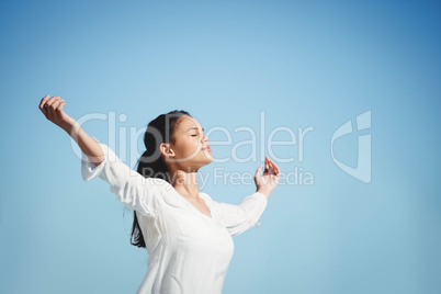 Calm brunette doing yoga