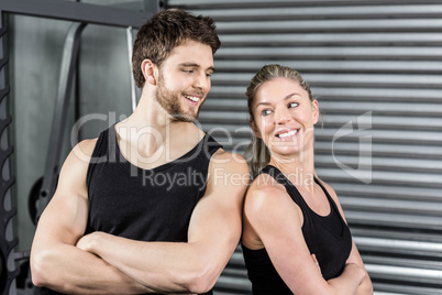 Fit couple with arm crossed