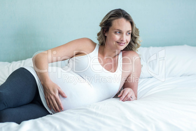 Pregnant woman touching her belly