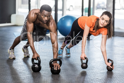 Athletic man and woman working out