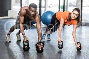 Athletic man and woman working out