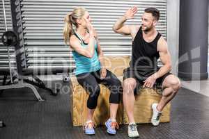 Fit couple doing high five