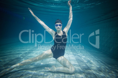 Pretty woman stretching underwater
