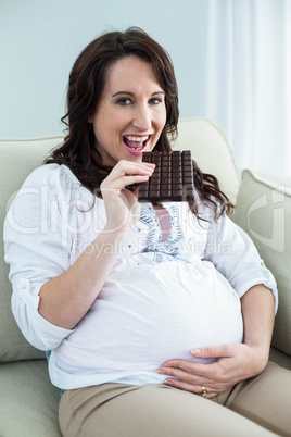 Pregnant woman eating chocolate