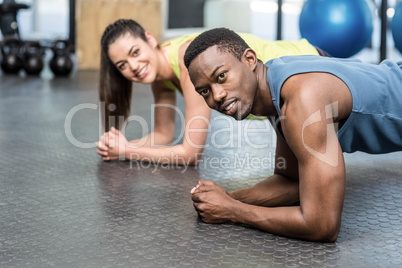 Athletic man and woman working out