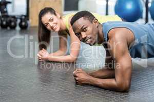 Athletic man and woman working out