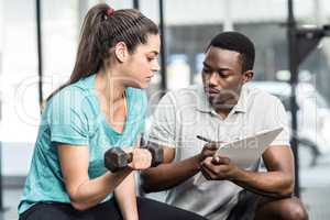 Trainer giving advice to woman