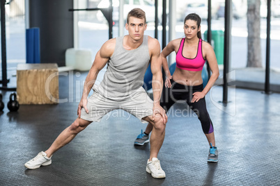 Athletic couple stretching