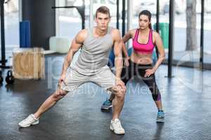 Athletic couple stretching