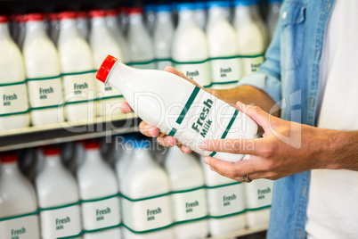 Man holding a bottle of milk