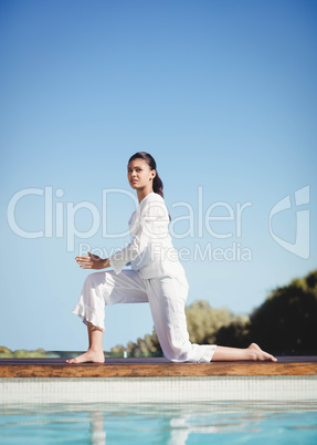 Calm brunette doing yoga
