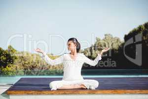 Calm brunette doing yoga