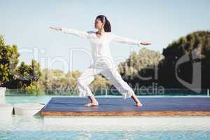 Calm brunette doing yoga