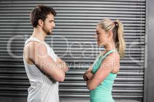 Fit couple with arm crossed