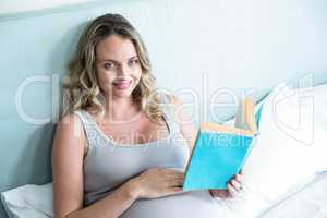 Pregnant woman reading a book