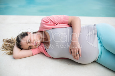 Pregnant woman relaxing outside