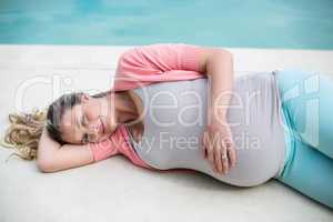Pregnant woman relaxing outside