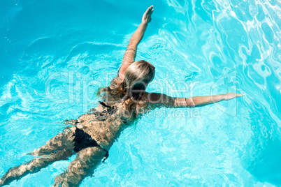 Fit woman swimming in the pool