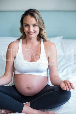 Pregnant woman doing yoga