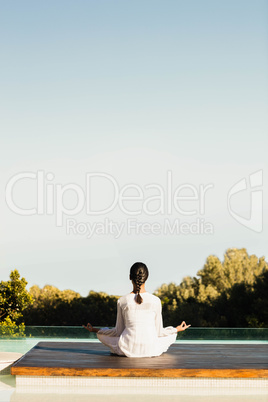 Calm brunette doing yoga