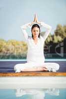 Calm brunette doing yoga