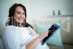 Pregnant woman resting on couch