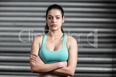 Portrait of fit woman with crossed arms