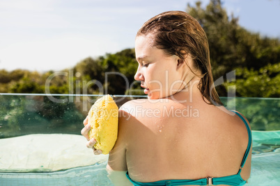 Beautiful blonde using sponge