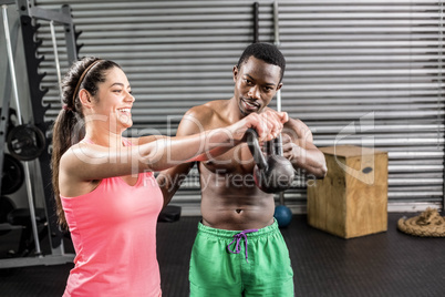 Fit couple lifting dumbbells
