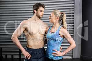 Athletic couple staring into each other in the eyes
