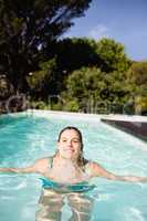 Smiling blonde heading out of water