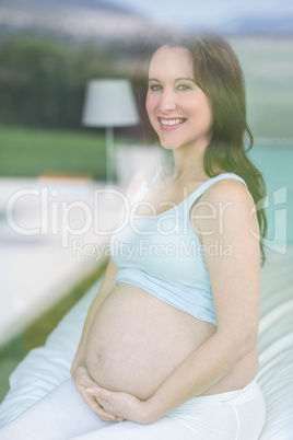 Pregnant woman touching belly