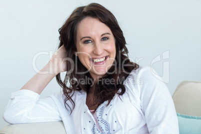 Pregnant woman sitting in the living room