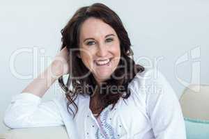 Pregnant woman sitting in the living room