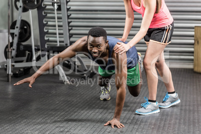 Fit couple doing exercises